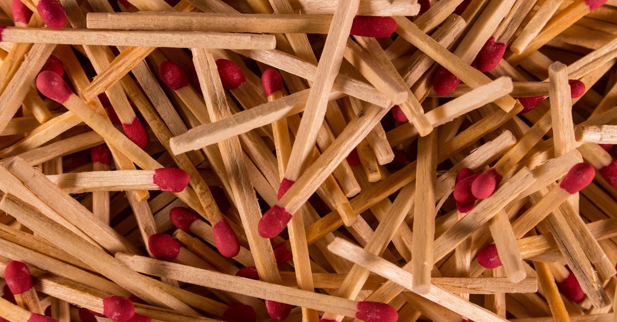 Why do Pocky and other "stick" biscuits have this distinct burn pattern? - From above of pile of wooden matchsticks with red heads scattered chaotically as abstract background Why do Pocky and other "stick" biscuits have this distinct burn pattern? - From above of pile of wooden matchsticks with red heads scattered chaotically as abstract background