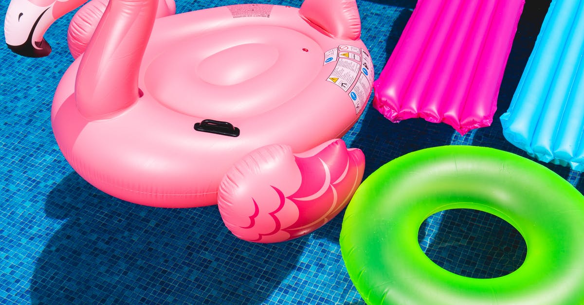 Why do some green gram seeds float on water while some don't? - Pink Flamingo Inflatable Ring and Green Inflatable Ring on Swimming Pool