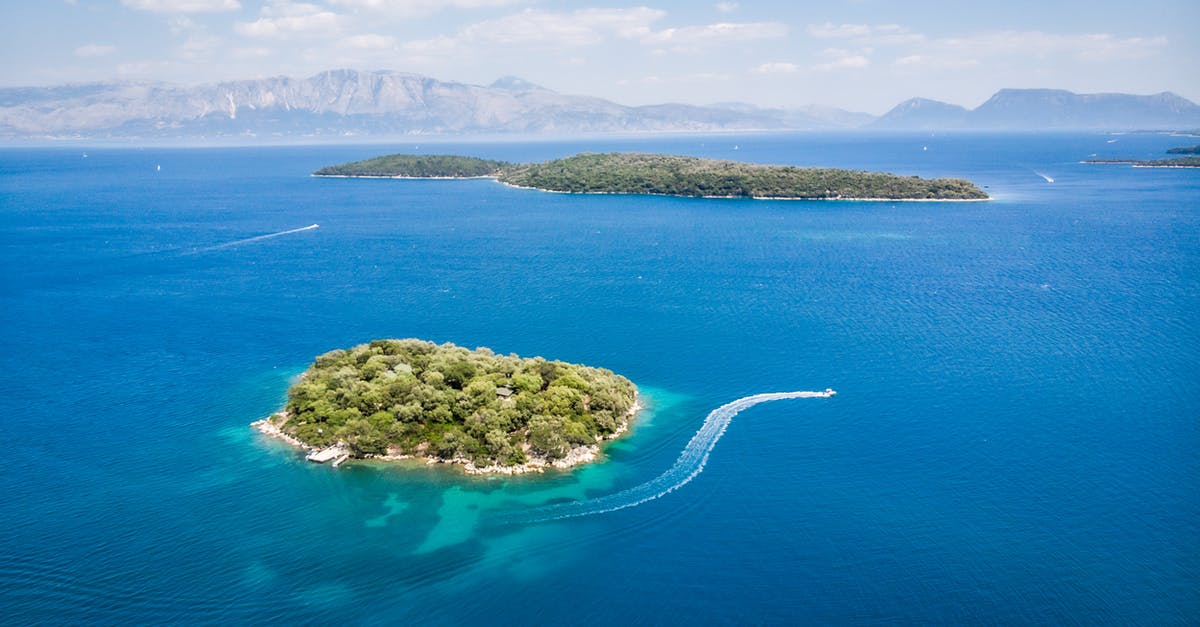 Why do some green gram seeds float on water while some don't? - Amazing aerial view of boats floating in turquoise sea near islands with lush green vegetation on sunny day