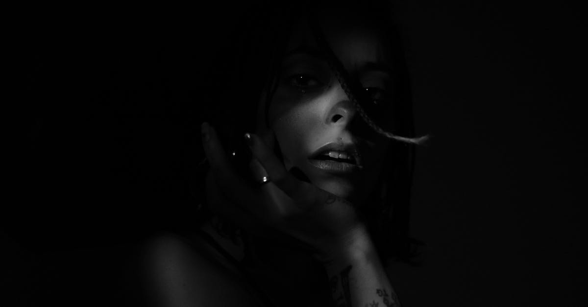 Why do some melons contain removeable dark tiny bits? - Unrecognizable woman with sensitive lips on black background at night Why do some melons contain removeable dark tiny bits? - Unrecognizable woman with sensitive lips on black background at night