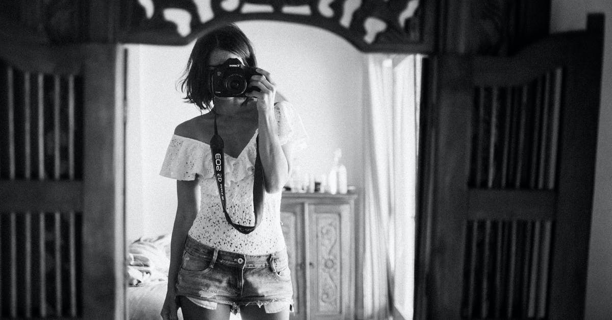 Why do some recipes recommend a short rest after mixing but before kneading the bread? - Black and white of casual female photographer in summer clothes standing against mirror in light room and taking photo with camera Why do some recipes recommend a short rest after mixing but before kneading the bread? - Black and white of casual female photographer in summer clothes standing against mirror in light room and taking photo with camera