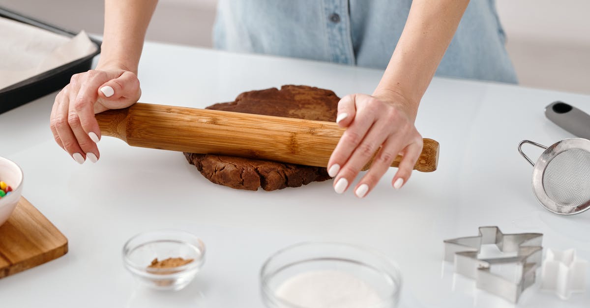 Why do some rolling pins only have one handle? - Person Flattening a Chocolate Dough With Rolling Pin Why do some rolling pins only have one handle? - Person Flattening a Chocolate Dough With Rolling Pin