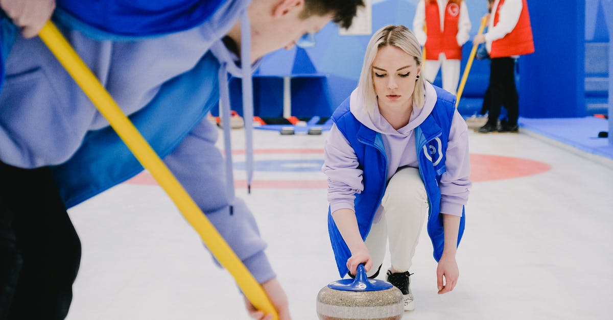 Why do spring onions curl up when placed in cold water? - Young man sweeping ice with broom and woman moving stone Why do spring onions curl up when placed in cold water? - Young man sweeping ice with broom and woman moving stone