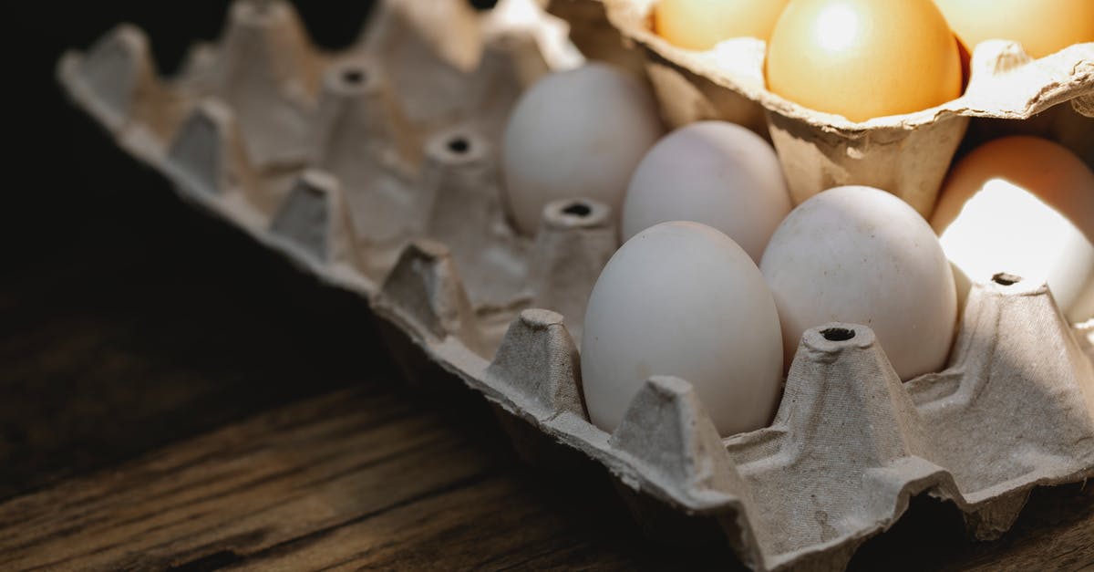 Why do stuffed shells recipes include eggs? - Carton box with fresh eggs placed on wooden surface Why do stuffed shells recipes include eggs? - Carton box with fresh eggs placed on wooden surface