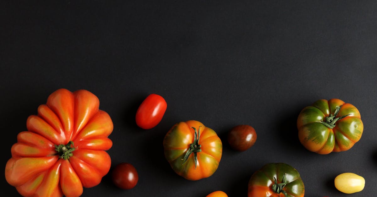Why do sun-dried tomatoes taste different than fresh tomatoes? - Different Fresh Tomatoes on Black Background Why do sun-dried tomatoes taste different than fresh tomatoes? - Different Fresh Tomatoes on Black Background
