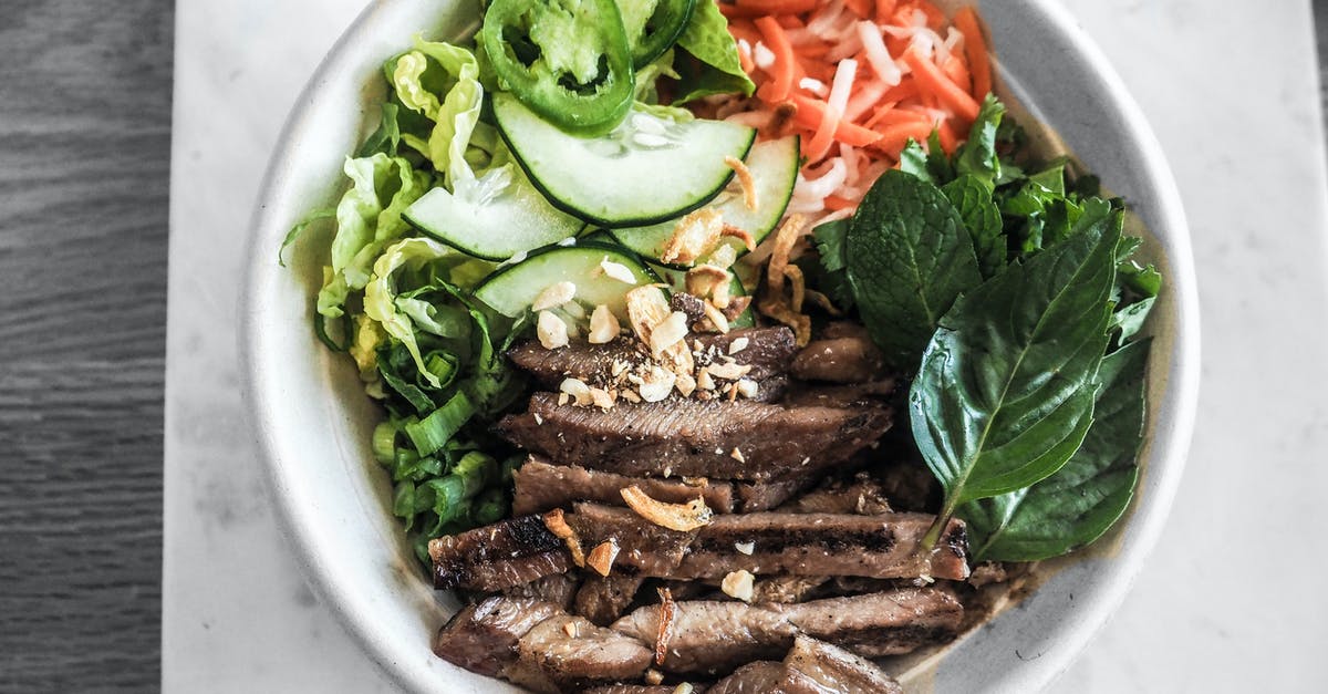 Why do Vietnamese dishes feature cut-up meat with the bone in? - Bowl of Sliced Vegetables and Meat Why do Vietnamese dishes feature cut-up meat with the bone in? - Bowl of Sliced Vegetables and Meat