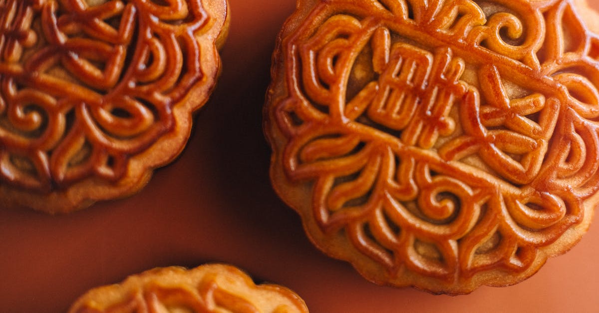 Why do we like dessert, but not extremely salty, sour, umami, or bitter foods alone? [closed] - Extreme Close-up Photo of Mooncakes