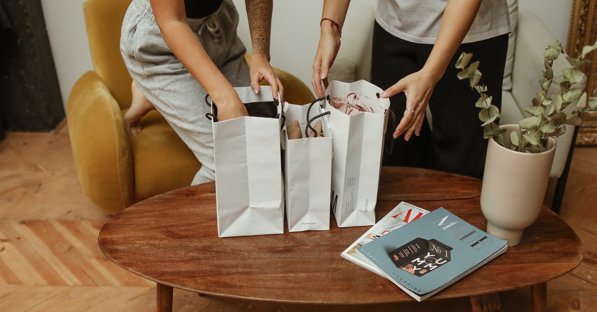 Why does a brown paper bag speed ripening? - Hand of Woman in Gray Pants Inside White Paper Bag Why does a brown paper bag speed ripening? - Hand of Woman in Gray Pants Inside White Paper Bag