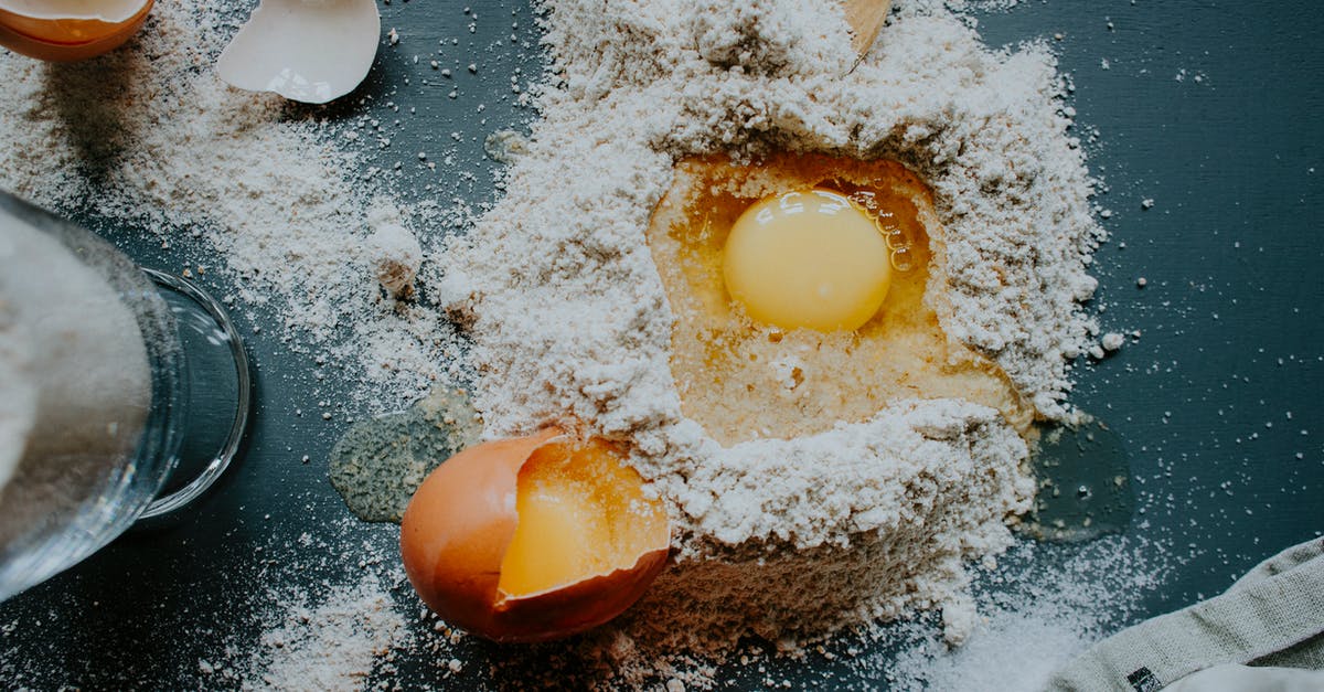 Why does a pizza stone make my pizza dough bread-like? - Ingredients for dough preparation on table Why does a pizza stone make my pizza dough bread-like? - Ingredients for dough preparation on table