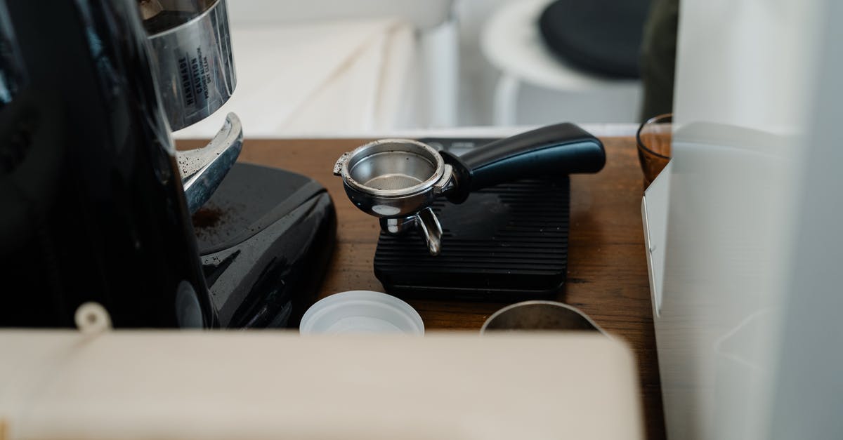 Why does a portafilter machine take so long to warm up and a modern machine doesn't? - Portafilter and coffee machine in kitchen Why does a portafilter machine take so long to warm up and a modern machine doesn't? - Portafilter and coffee machine in kitchen