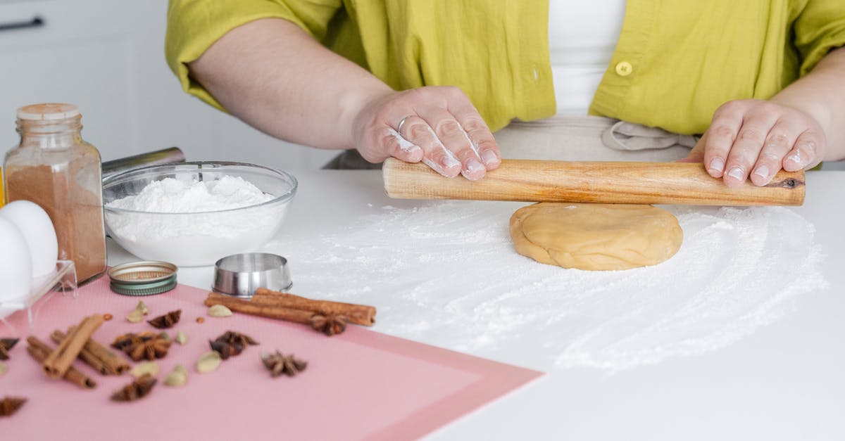 Why does boiling water make dough taste sweet? - Unrecognizable woman rolling dough on table Why does boiling water make dough taste sweet? - Unrecognizable woman rolling dough on table