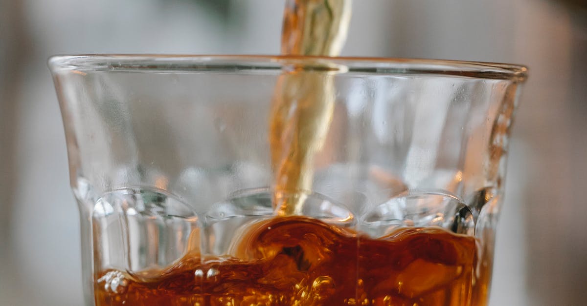 Why does caffeine taste bitter when added to tea? - Aromatic black tea pouring into glass Why does caffeine taste bitter when added to tea? - Aromatic black tea pouring into glass