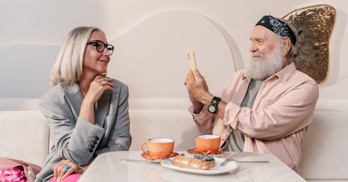 Why does cheese have an expiry date? - Elderly Man Taking Picture of a Woman Why does cheese have an expiry date? - Elderly Man Taking Picture of a Woman