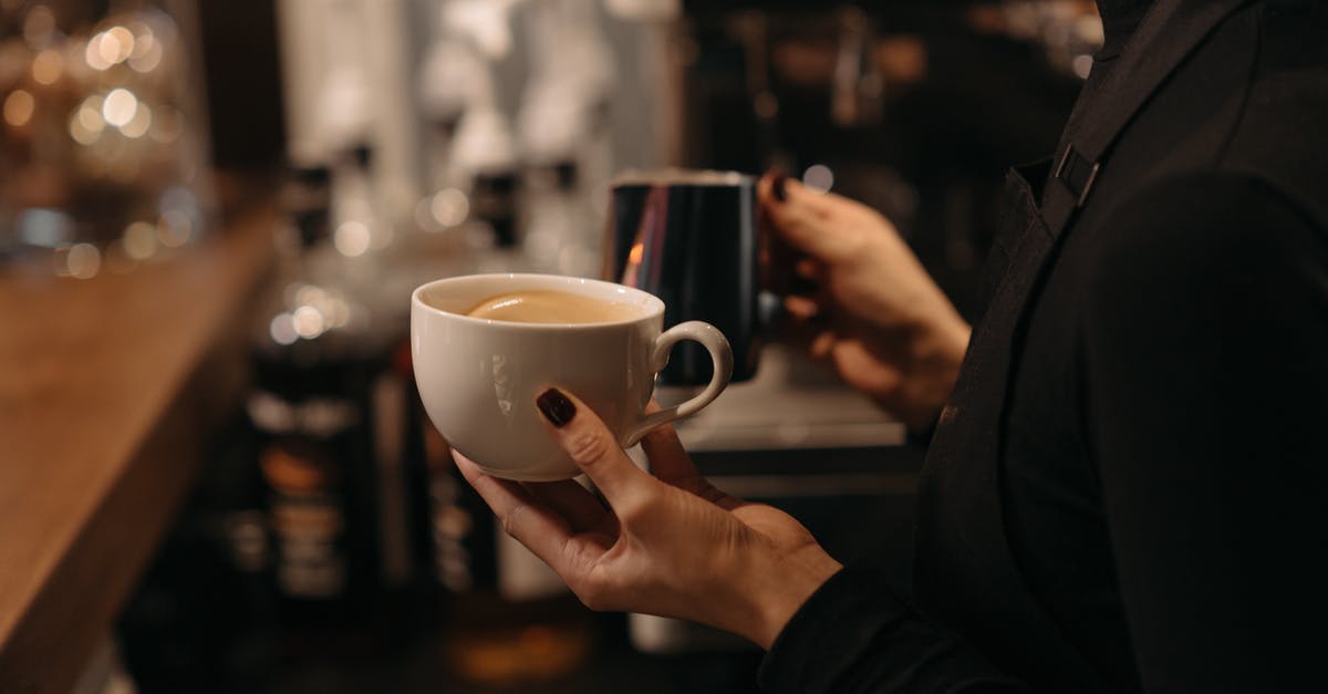 Why does coconut milk separate in coffee? - A Person in Black Long Sleeves Making Coffee Why does coconut milk separate in coffee? - A Person in Black Long Sleeves Making Coffee
