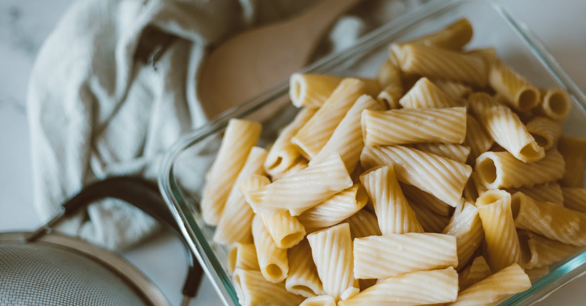 Why does milk curdle after being boiled with ginger? - Brown Pasta on Stainless Steel Tray