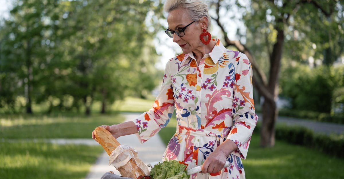 Why does my bread collapse in my bread machine? - Woman in White Red and Yellow Floral Dress Holding Brown Wicker Basket Why does my bread collapse in my bread machine? - Woman in White Red and Yellow Floral Dress Holding Brown Wicker Basket