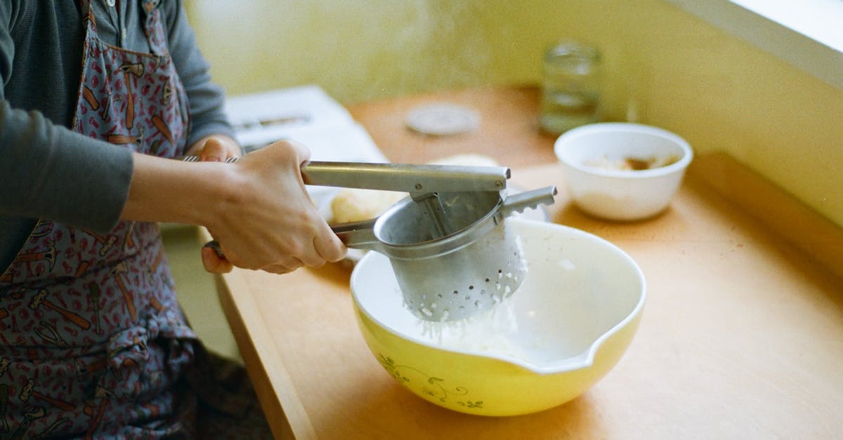 Why does my flour sifter have cup markings - Person Sifting Flour Into a Yellow Bowl