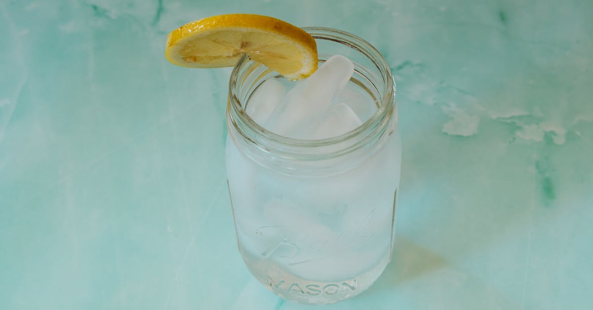 Why does my lemon tart filling sometimes curdle? - Glass of Water with Ice Cubes and a Slice of Lemon