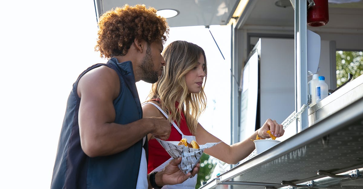 Why does sauce go watery after freezing? - Multiethnic couple having lunch at street food truck Why does sauce go watery after freezing? - Multiethnic couple having lunch at street food truck