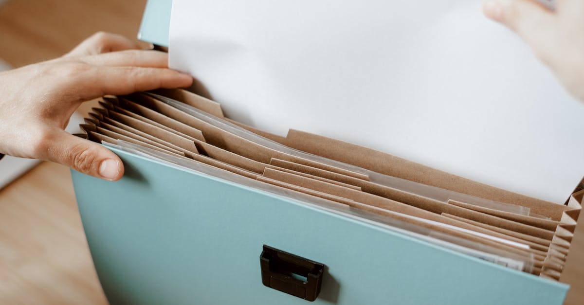 Why does soymilk take longer to expire? - Person taking white paper from folder Why does soymilk take longer to expire? - Person taking white paper from folder