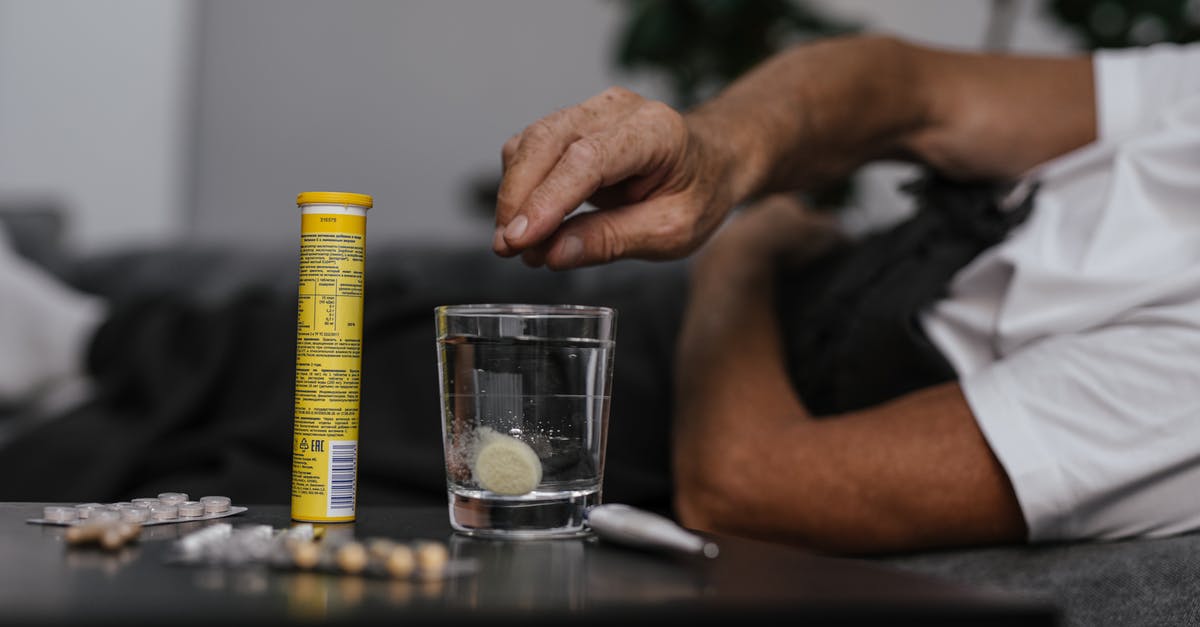 Why does spatzle dissolve in water? - Person Putting Medicine on the Glass of Water 