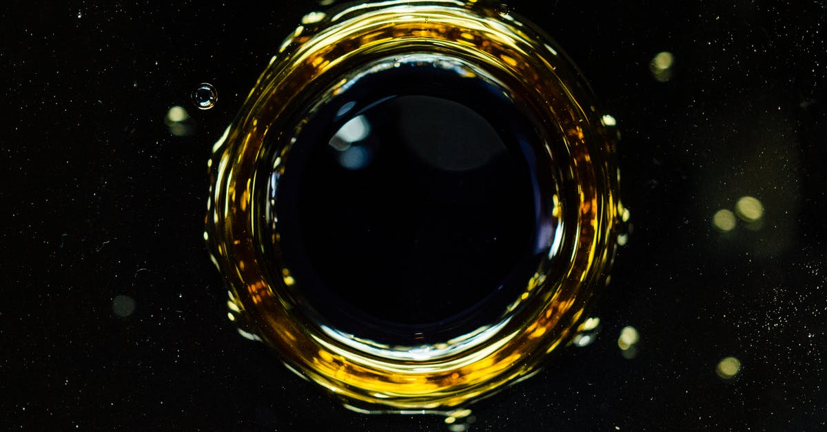 Why does spatzle dissolve in water? - Background of macro drop falling into dark liquid and forming circle and bubbles on surface