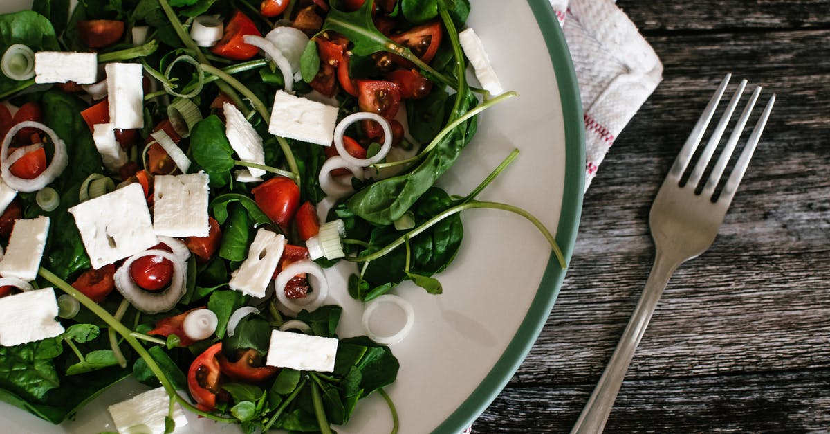 Why does spinach come in an airtight bag? - Vegetable Salad on White Ceramic Plate Beside Grey Stainless Steel Fork
