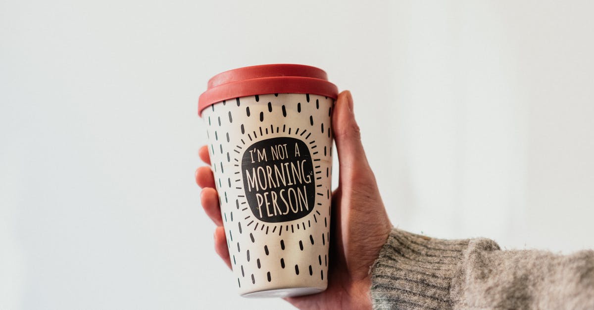 Why does the instant coffee that I store in little plastic tubs go bad? - Crop unrecognizable person demonstrating message on paper cup of takeaway hot drink with ornament on white background Why does the instant coffee that I store in little plastic tubs go bad? - Crop unrecognizable person demonstrating message on paper cup of takeaway hot drink with ornament on white background