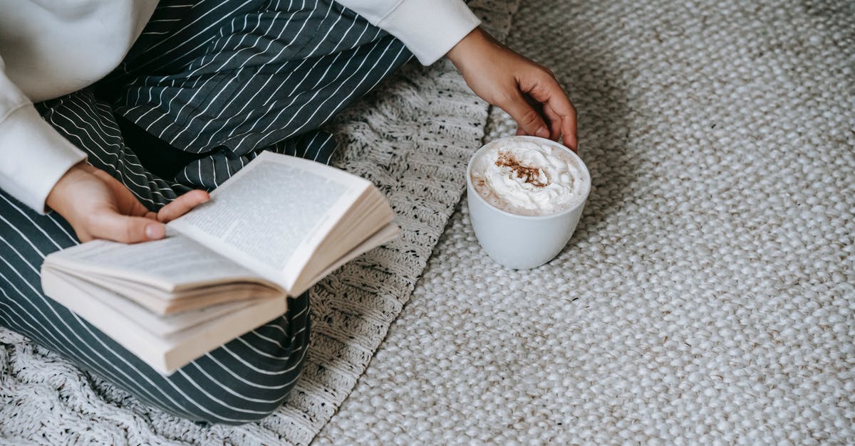 Why does whipped Cream sometimes sink in warm beverages? - From above of crop anonymous female sitting with crossed legs and reading book with mug of coffee with whipped cream while resting at home Why does whipped Cream sometimes sink in warm beverages? - From above of crop anonymous female sitting with crossed legs and reading book with mug of coffee with whipped cream while resting at home