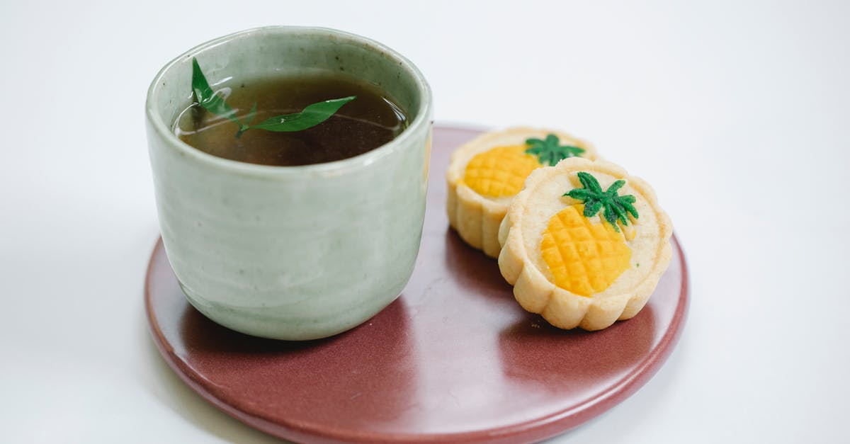 Why does whole leaf tea leave a residue in the cup? - Black tea with tasty sweet pastries on plate Why does whole leaf tea leave a residue in the cup? - Black tea with tasty sweet pastries on plate
