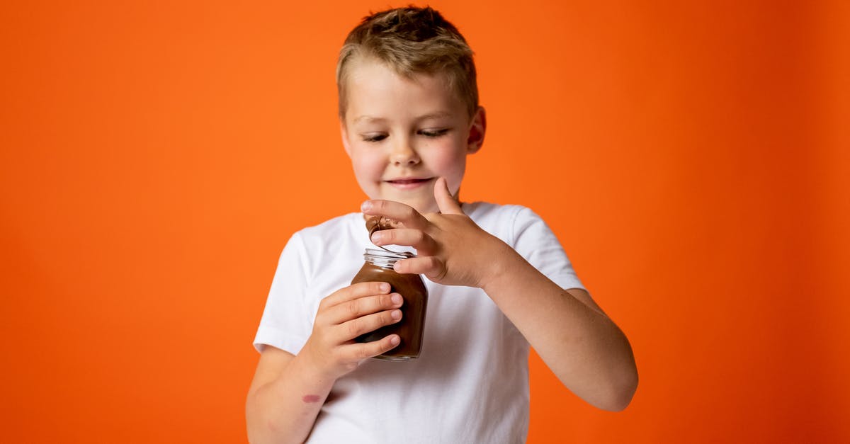 Why doesn't chocolate go bad? - Boy in White Crew Neck T-shirt Holding Chocolate Jar Why doesn't chocolate go bad? - Boy in White Crew Neck T-shirt Holding Chocolate Jar