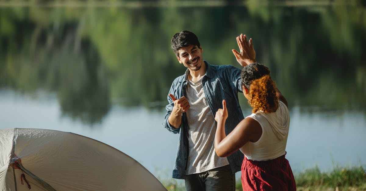 Why don't other grain proteins behave like gluten? - Glad male hiker with unrecognizable ethnic female beloved showing thumbs up and giving high five while looking at each other in campsite Why don't other grain proteins behave like gluten? - Glad male hiker with unrecognizable ethnic female beloved showing thumbs up and giving high five while looking at each other in campsite