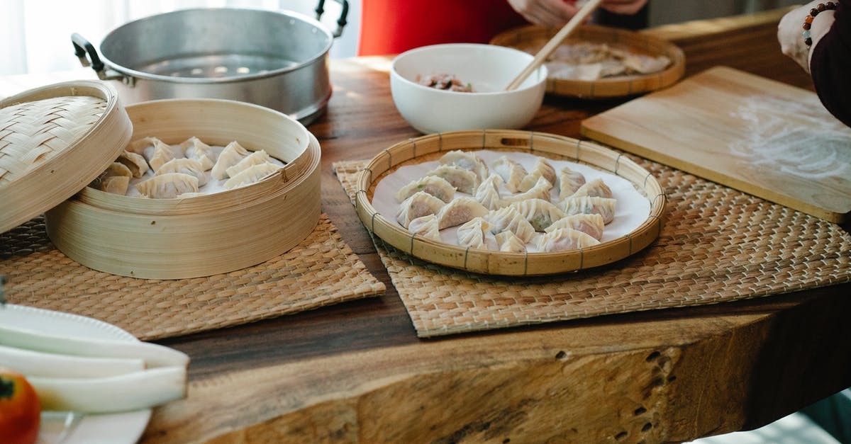 Why fold in ingredients, why not just whisk? - Crop unrecognizable ladies folding traditional Chinese dumplings in kitchen Why fold in ingredients, why not just whisk? - Crop unrecognizable ladies folding traditional Chinese dumplings in kitchen