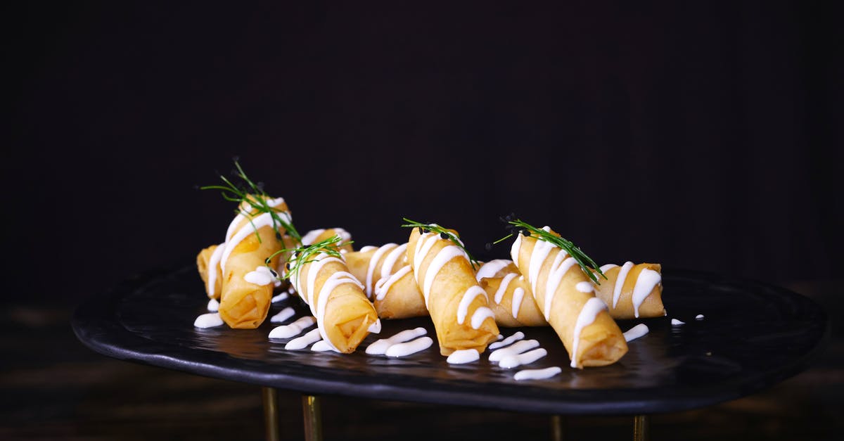 Why fry a teaspoon of dal to start an Indian dish? - Fried Spring Rolls with White Cream and Green Leaves Why fry a teaspoon of dal to start an Indian dish? - Fried Spring Rolls with White Cream and Green Leaves