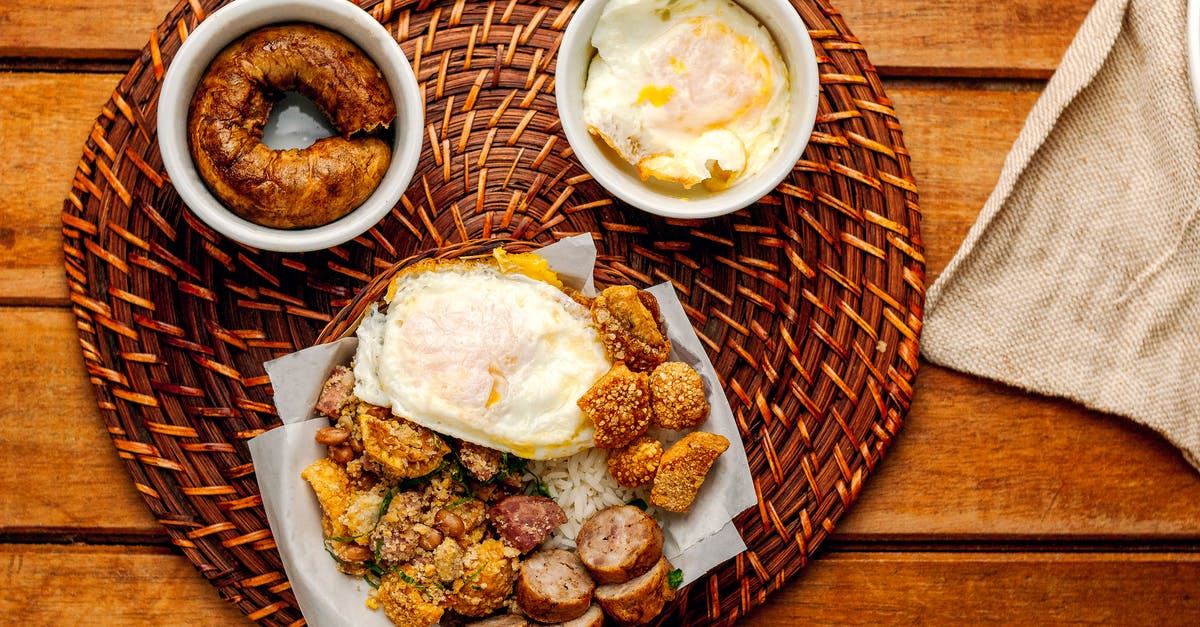 Why fry rice before boiling? - Scrumptious fried sausages and eggs served on pad Why fry rice before boiling? - Scrumptious fried sausages and eggs served on pad