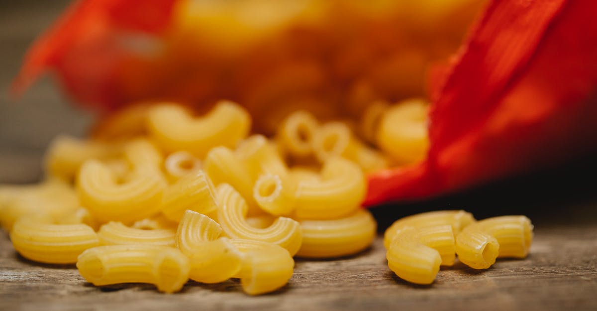 Why hot pack when raw pack is just as fast? - Heap of raw textured pasta scattered on table