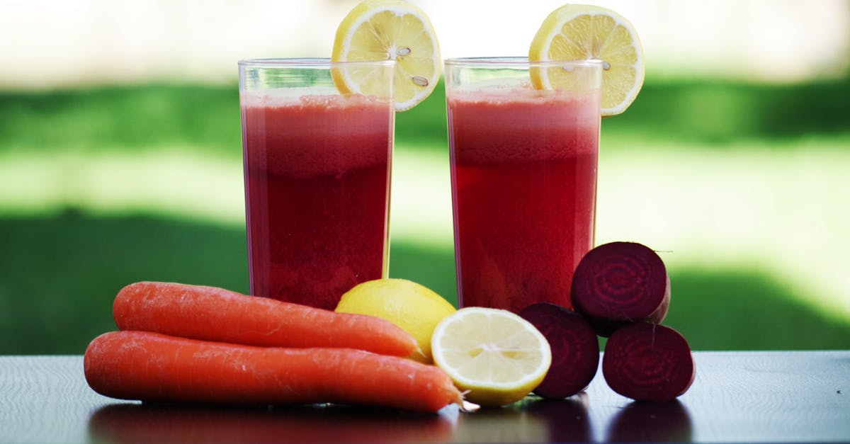 Why is carrot juice so sweet? - Carrot Fruit Beside Lemon Fruit on Black Wooden Table Why is carrot juice so sweet? - Carrot Fruit Beside Lemon Fruit on Black Wooden Table