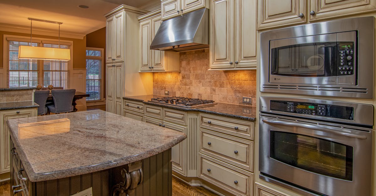why is exterior of the microwave oven getting hot & the lights getting switched off [closed] - Silver Microwave Oven on Brown Wooden Kitchen Cabinet