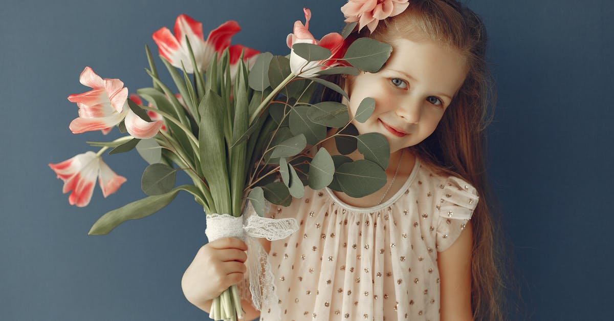 Why is Ginger essence hard to get hold of? - Adorable girl with flowers smiling at camera