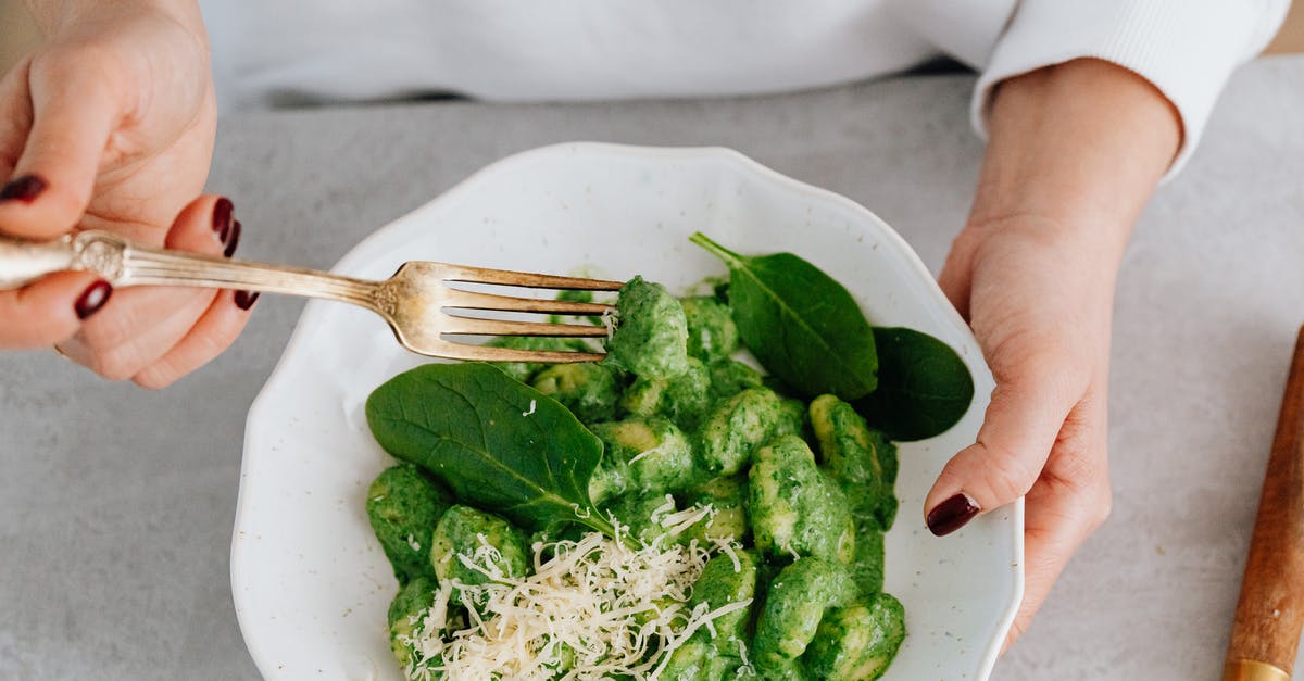 Why is gnocchi a dumpling and not a noodle? - A Person Holding a Ceramic Plate and Fork with Gnocchi Why is gnocchi a dumpling and not a noodle? - A Person Holding a Ceramic Plate and Fork with Gnocchi