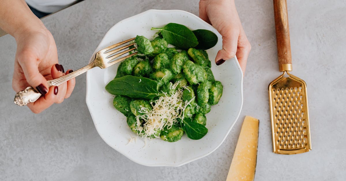 Why is gnocchi a dumpling and not a noodle? - A Person Holding a Plate and a Fork with Green Food Why is gnocchi a dumpling and not a noodle? - A Person Holding a Plate and a Fork with Green Food
