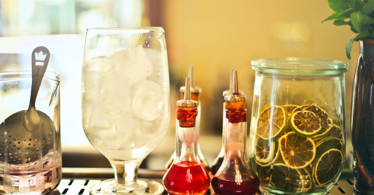 Why is maple syrup less viscous than other liquid sugars? - Glass of ice cubes on counter with ingredients Why is maple syrup less viscous than other liquid sugars? - Glass of ice cubes on counter with ingredients