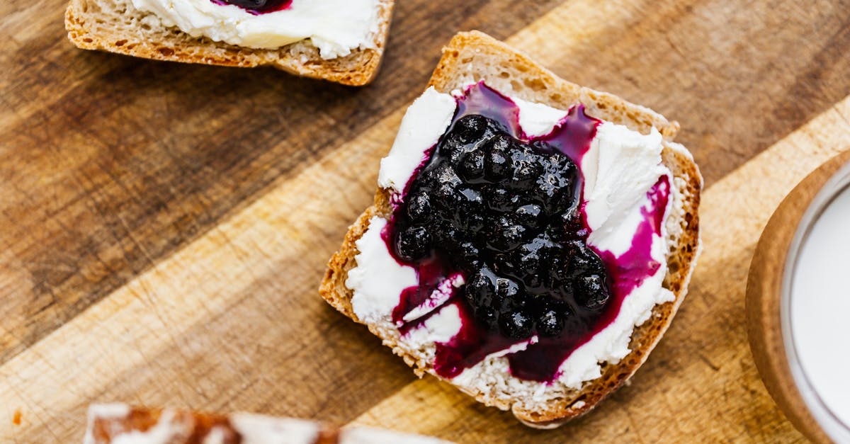 Why is my blueberry jam grainy? - Bread with Blueberry Jam and Cream on Brown Wooden Table Why is my blueberry jam grainy? - Bread with Blueberry Jam and Cream on Brown Wooden Table