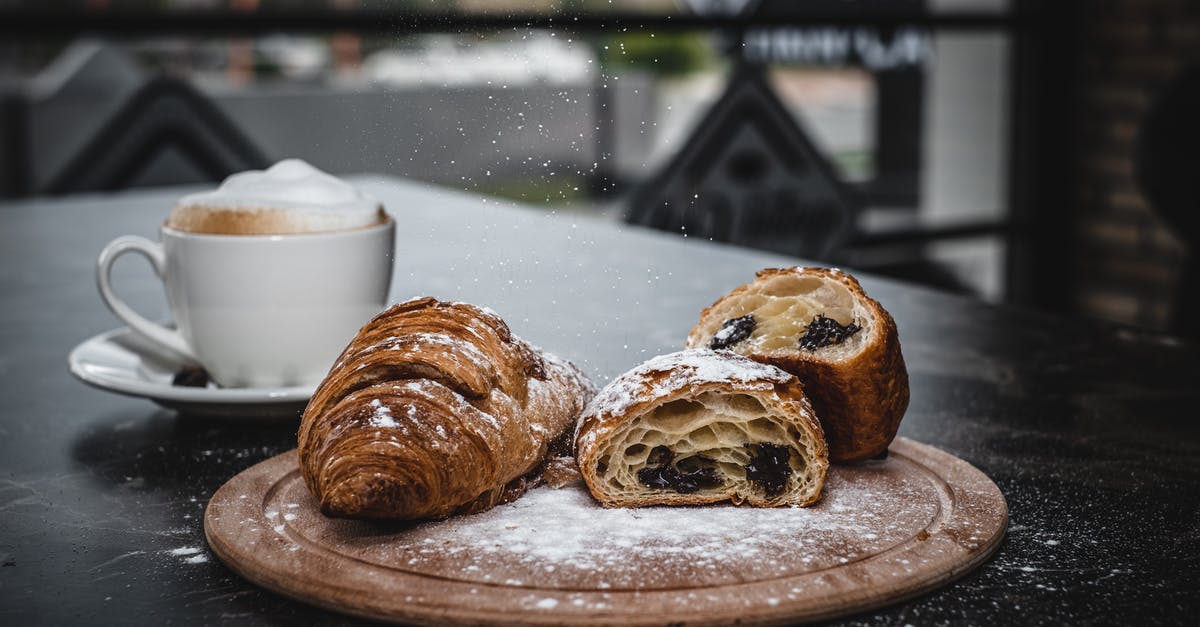 Why is my bread falling flat? - Croissants Being Dusted with Powdered Sugar Why is my bread falling flat? - Croissants Being Dusted with Powdered Sugar