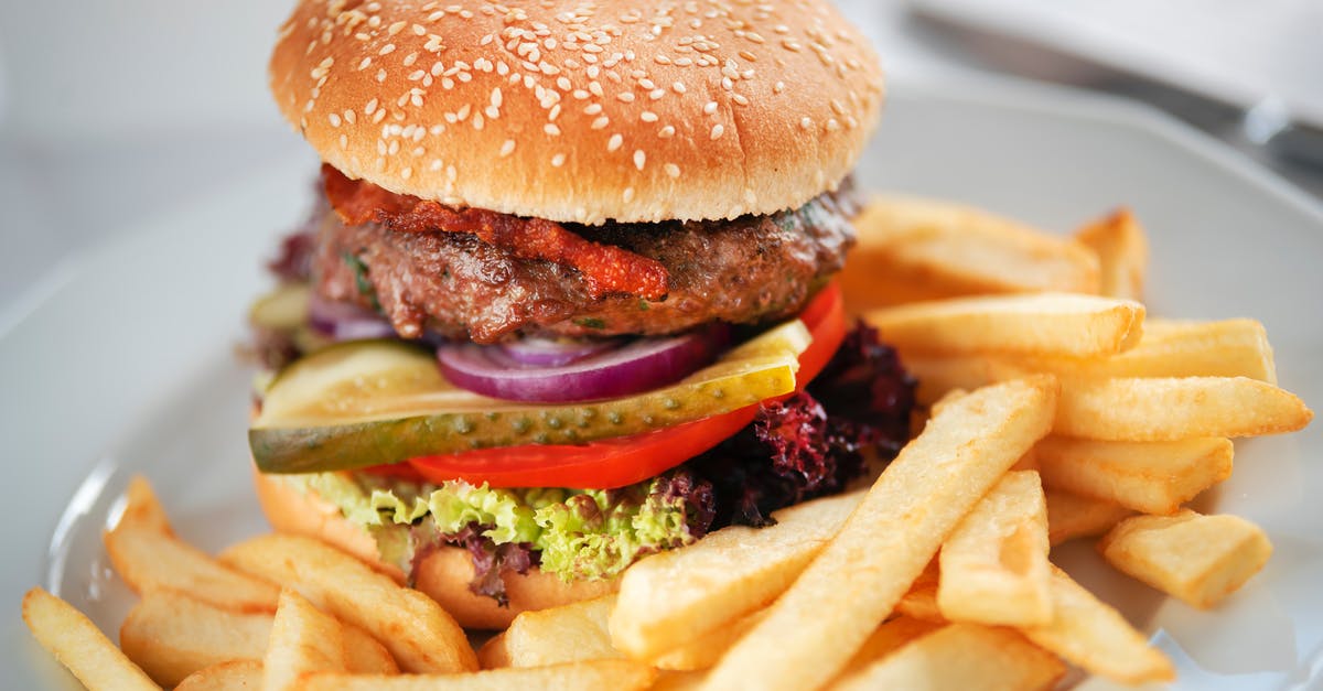 Why is my onion pickle taking super long? - Tasty burger with juicy patty and tomato with pickle slices between buns with sesame seeds near deep fried potato sticks Why is my onion pickle taking super long? - Tasty burger with juicy patty and tomato with pickle slices between buns with sesame seeds near deep fried potato sticks