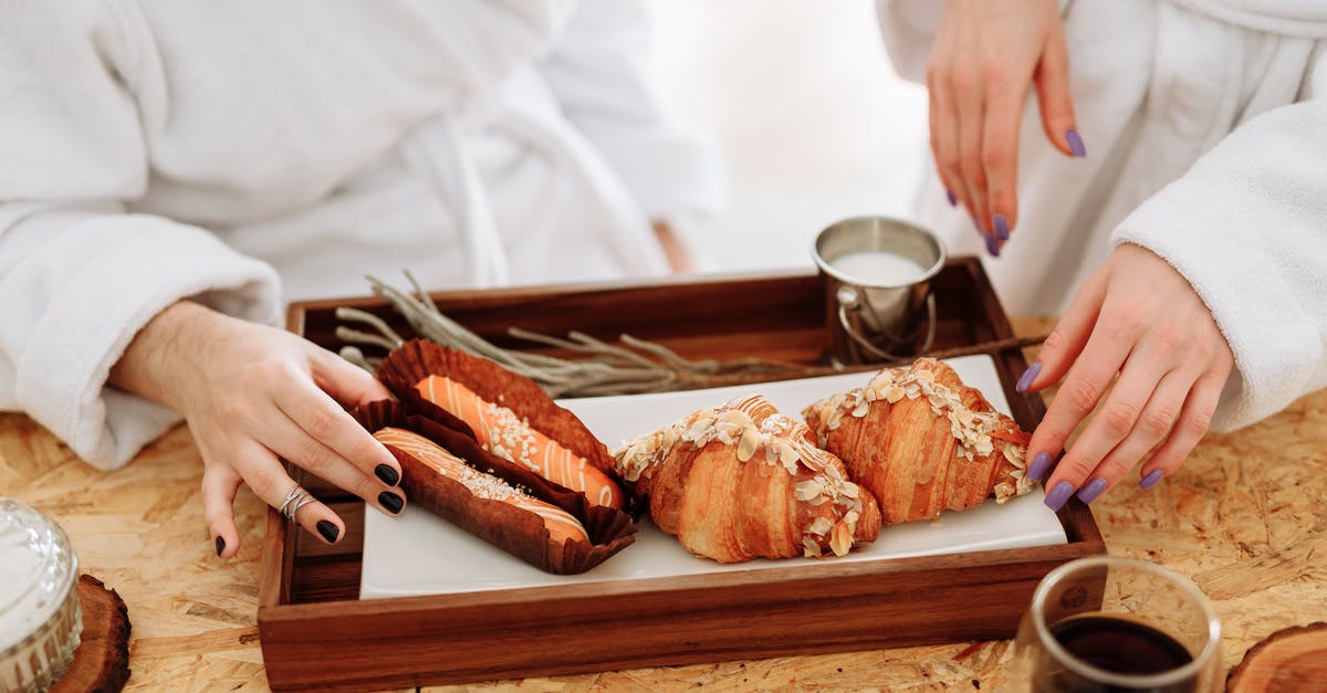 Why is my white bread with poolish dough very loose? - Person Holding Bread on Brown Wooden Tray Why is my white bread with poolish dough very loose? - Person Holding Bread on Brown Wooden Tray
