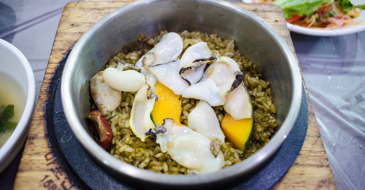Why is rice parboiled? And how does parboiling change rice? - Close-up of Abalone Rice Hot Pot Why is rice parboiled? And how does parboiling change rice? - Close-up of Abalone Rice Hot Pot
