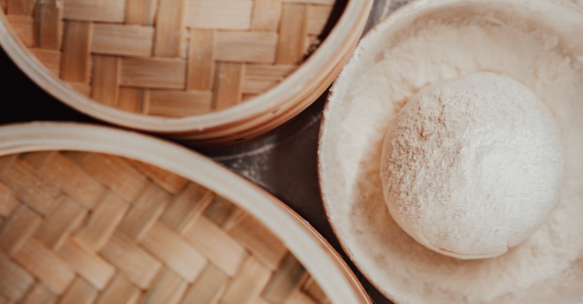 Why is rock sugar used in Chinese cooking? - White Round Ceramic Bowl on Brown Wooden Table Why is rock sugar used in Chinese cooking? - White Round Ceramic Bowl on Brown Wooden Table