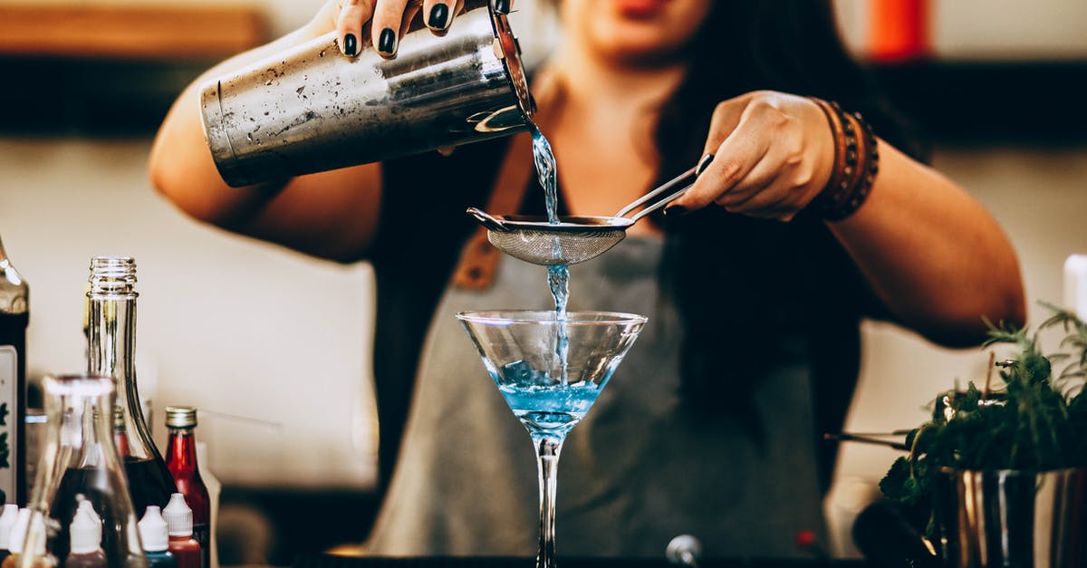 Why is Rum not affected by distillation like Vodka is? - Photo of Woman Pouring Liquid From Drink Mixer Why is Rum not affected by distillation like Vodka is? - Photo of Woman Pouring Liquid From Drink Mixer
