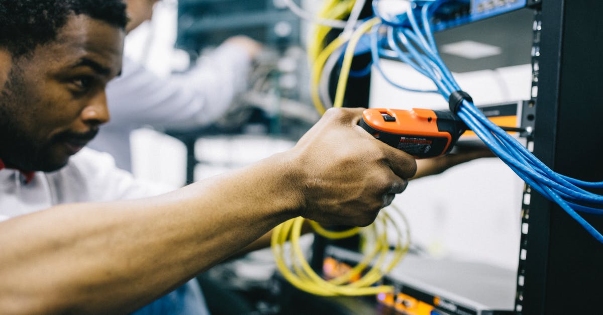 Why is the Gastronorm system based on 530 × 325mm? - Crop focused ethnic engineer using electric screwdriver Why is the Gastronorm system based on 530 × 325mm? - Crop focused ethnic engineer using electric screwdriver